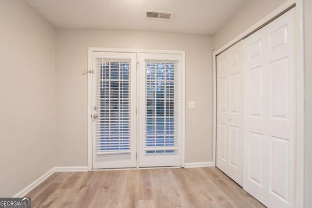 7113 Ambercrest Ct, Austell, GA 30168 - unfurnished bedroom featuring light wood finished floors and a closet