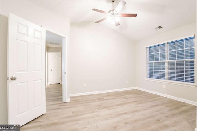 7113 Ambercrest Ct, Austell, GA 30168 - empty room with light wood-type flooring, a ceiling fan, and lofted ceiling