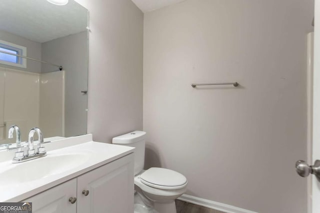 7113 Ambercrest Ct, Austell, GA 30168 - bathroom featuring a shower, vanity, and wood finished floors