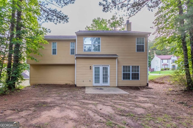 7113 Ambercrest Ct, Austell, GA 30168 - back of property with a patio and a chimney