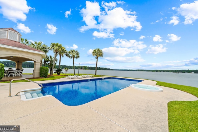 745 Chickasaw Trl S, Sparta, GA 31087 - view of pool with a patio, a water view, and a pool with connected hot tub