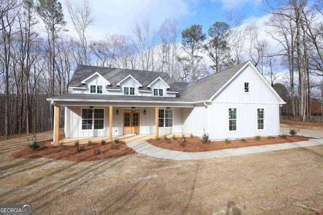 84 Puckett Station Dr, Moreland, GA 30259 - modern farmhouse style home featuring a porch and french doors