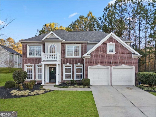 3224 Wolf Club Ln SW, Atlanta, GA 30349 - colonial home with driveway, a front lawn, brick siding, and an attached garage