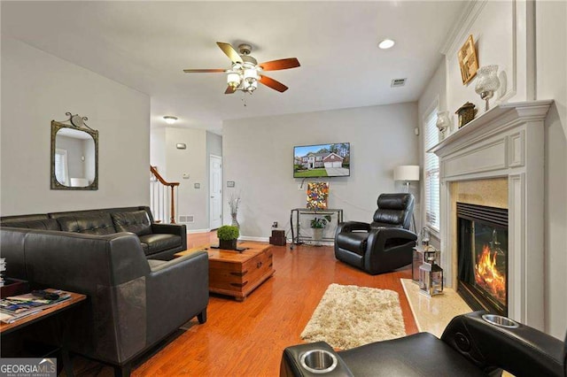 3224 Wolf Club Ln SW, Atlanta, GA 30349 - living room with ceiling fan, a premium fireplace, and light wood-type flooring