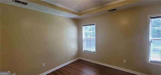 1934 Mcconnell Rd, Grayson, GA 30017 - unfurnished room with ornamental molding, dark wood-style floors, healthy amount of natural light, and a textured ceiling