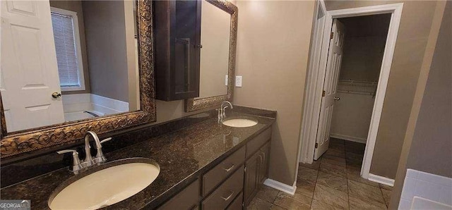 1934 Mcconnell Rd, Grayson, GA 30017 - bathroom featuring double vanity and baseboards