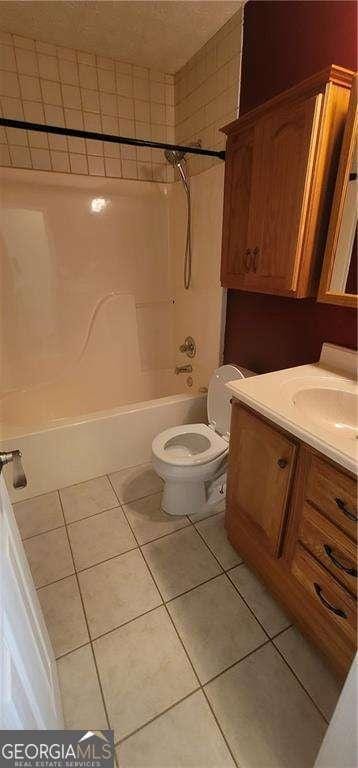 1934 Mcconnell Rd, Grayson, GA 30017 - full bath with tile patterned floors, vanity, and  shower combination