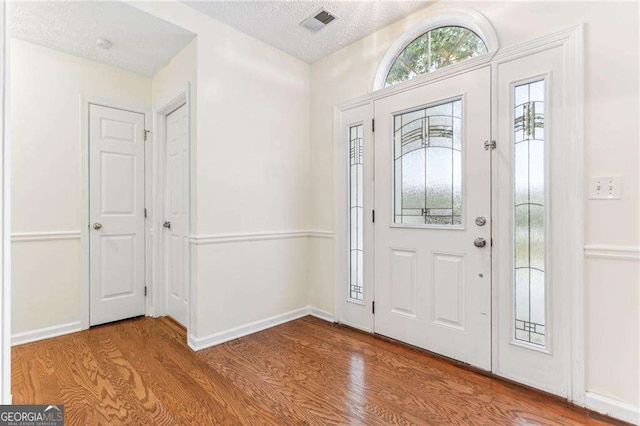1934 Mcconnell Rd, Grayson, GA 30017 - foyer featuring wood finished floors and a textured ceiling