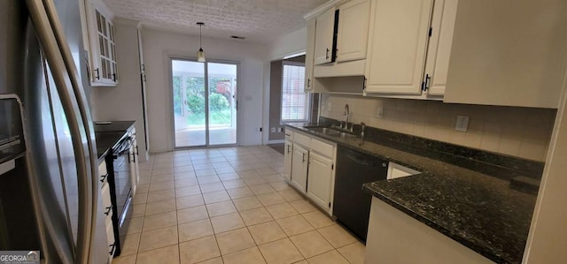 1934 Mcconnell Rd, Grayson, GA 30017 - kitchen featuring dishwasher, freestanding refrigerator, decorative backsplash, white cabinets, and hanging light fixtures