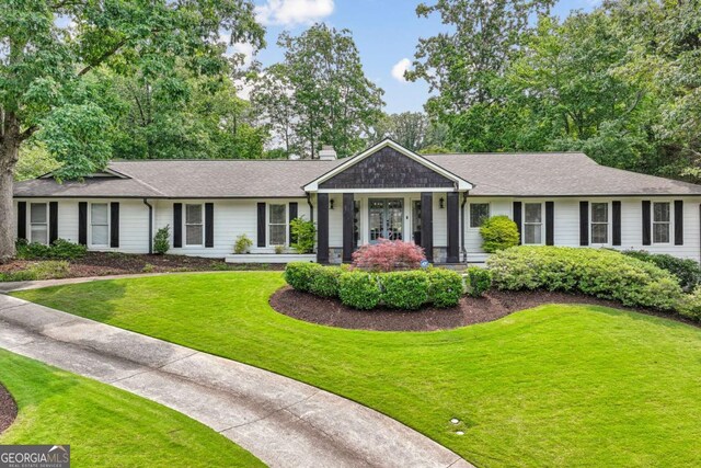 5860 Riverwood Dr, Sandy Springs, GA 30328 - ranch-style home with a front yard, a chimney, and roof with shingles