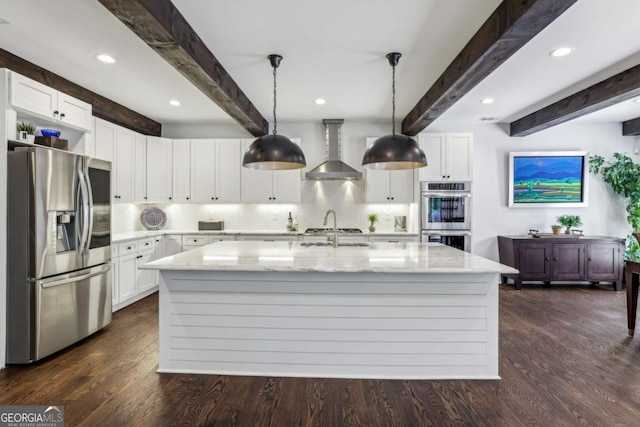 5860 Riverwood Dr, Sandy Springs, GA 30328 - kitchen with stainless steel appliances, wall chimney exhaust hood, beamed ceiling, light stone countertops, and an island with sink