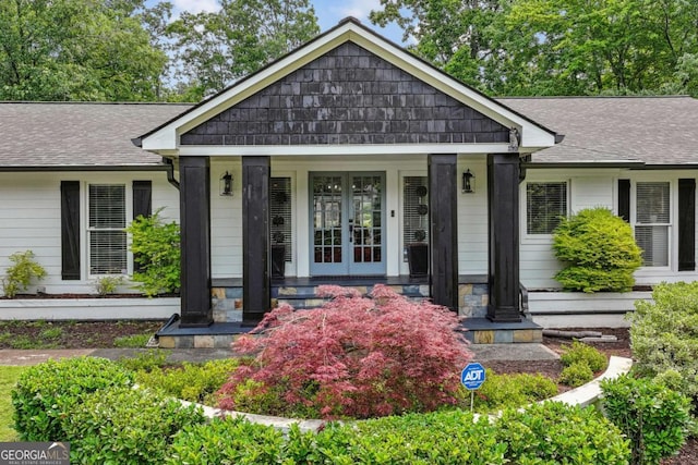 5860 Riverwood Dr, Sandy Springs, GA 30328 - view of front of house with covered porch, a shingled roof, and french doors