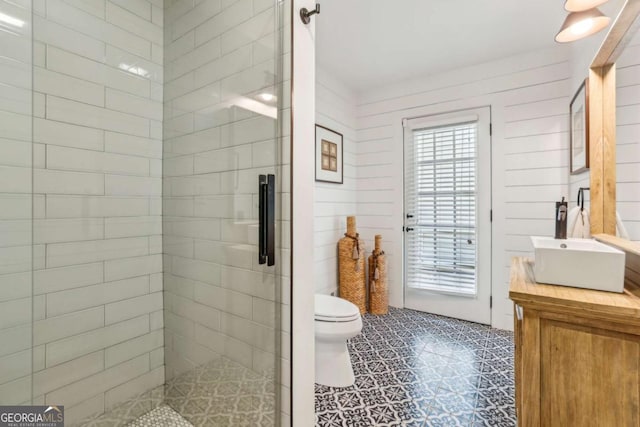 5860 Riverwood Dr, Sandy Springs, GA 30328 - bathroom with vanity, toilet, a shower stall, and tile patterned floors