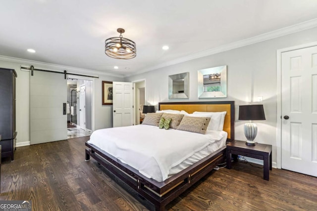 5860 Riverwood Dr, Sandy Springs, GA 30328 - bedroom with a barn door, ornamental molding, wood finished floors, recessed lighting, and baseboards
