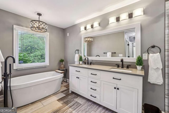 5860 Riverwood Dr, Sandy Springs, GA 30328 - bathroom featuring double vanity and a freestanding bath
