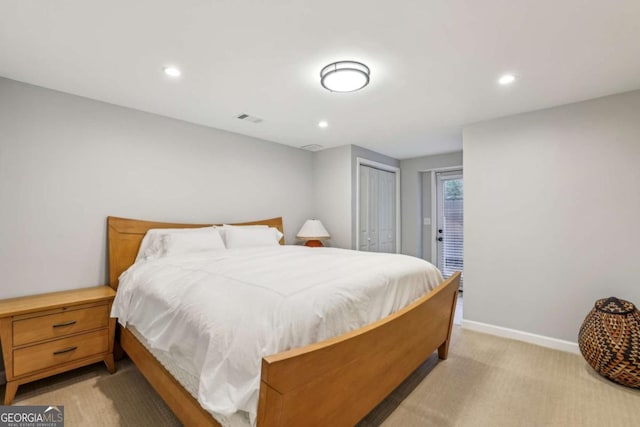 5860 Riverwood Dr, Sandy Springs, GA 30328 - bedroom with light colored carpet, recessed lighting, baseboards, and a closet