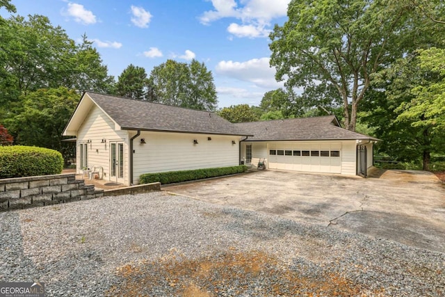 5860 Riverwood Dr, Sandy Springs, GA 30328 - view of front of house featuring concrete driveway and an attached garage