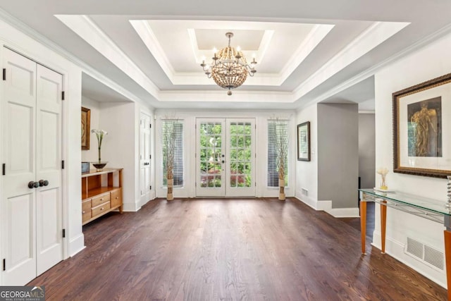 5860 Riverwood Dr, Sandy Springs, GA 30328 - entryway with a chandelier, a raised ceiling, ornamental molding, baseboards, and dark wood finished floors
