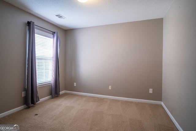 2938 Cottesford Way SE, Smyrna, GA 30080 - empty room featuring healthy amount of natural light, light colored carpet, and a textured ceiling