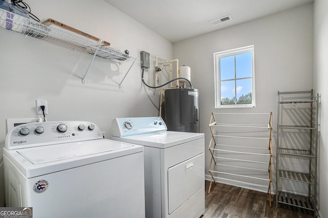 1776 Cheryl Ave, Griffin, GA 30224 - laundry area with water heater, washing machine and dryer, and dark wood-type flooring