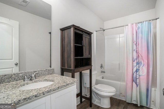 1776 Cheryl Ave, Griffin, GA 30224 - full bathroom with wood finished floors, shower / bath combo with shower curtain, and vanity