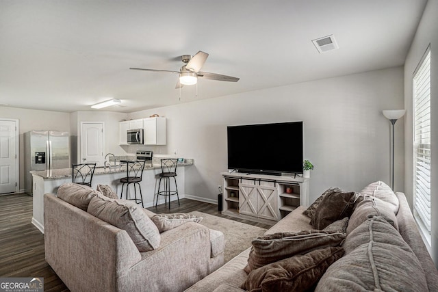 1776 Cheryl Ave, Griffin, GA 30224 - living area featuring dark wood-style floors and ceiling fan