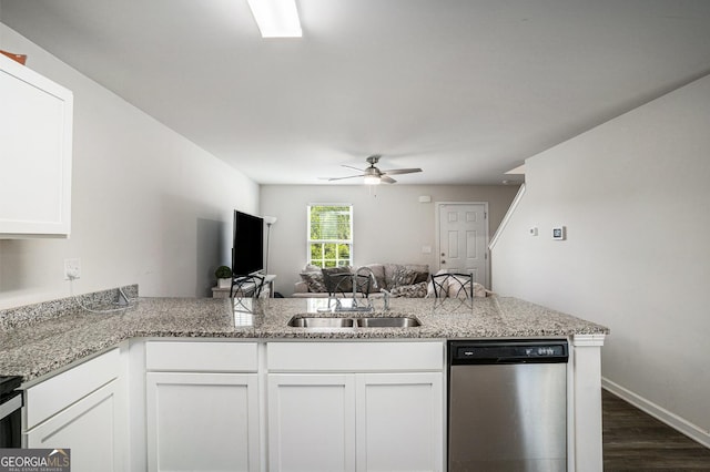 1776 Cheryl Ave, Griffin, GA 30224 - kitchen with dishwasher, open floor plan, dark wood-style floors, white cabinets, and ceiling fan