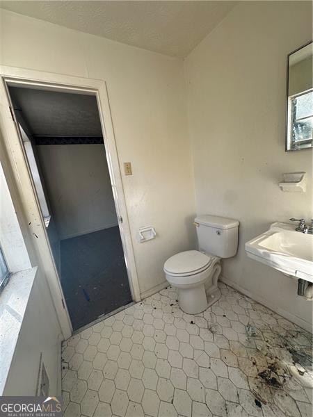 8423 Avalon Dr, Riverdale, GA 30274 - bathroom with toilet and a sink