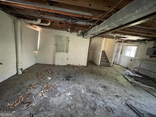 8423 Avalon Dr, Riverdale, GA 30274 - basement featuring stairway and electric panel