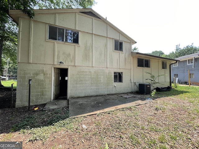 8423 Avalon Dr, Riverdale, GA 30274 - back of property with central AC unit and board and batten siding
