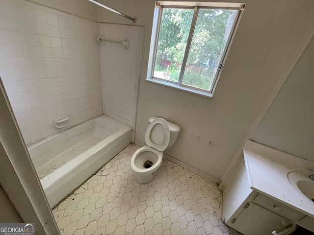 8423 Avalon Dr, Riverdale, GA 30274 - bathroom featuring toilet, shower / tub combination, baseboards, and vanity