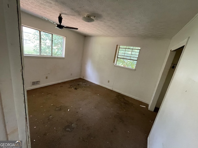 8423 Avalon Dr, Riverdale, GA 30274 - unfurnished bedroom with a textured ceiling, baseboards, and ceiling fan