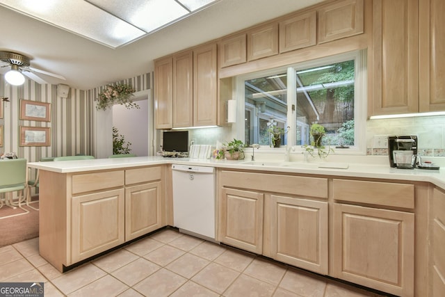 8120 Ball Mill Rd, Atlanta, GA 30350 - kitchen with white dishwasher, light brown cabinets, a peninsula, and wallpapered walls