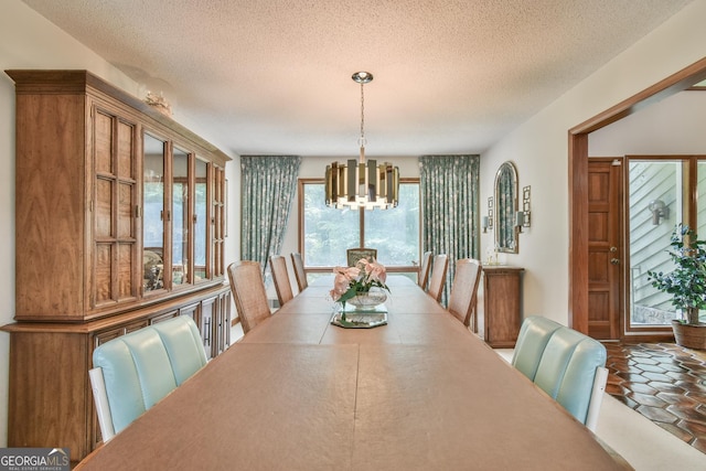 8120 Ball Mill Rd, Atlanta, GA 30350 - dining area with a chandelier and a textured ceiling