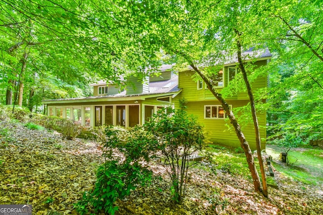 8120 Ball Mill Rd, Atlanta, GA 30350 - rear view of house with a sunroom