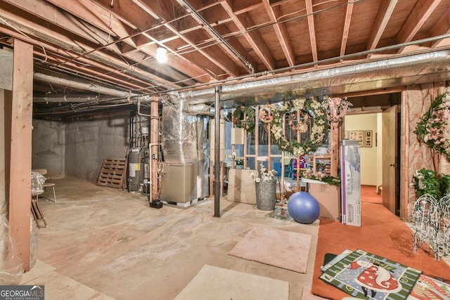 8120 Ball Mill Rd, Atlanta, GA 30350 - unfinished basement featuring water heater and heating unit