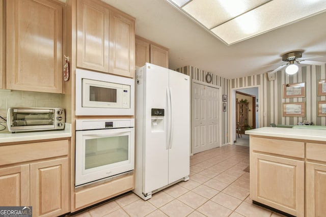 8120 Ball Mill Rd, Atlanta, GA 30350 - kitchen featuring white appliances, light brown cabinetry, light tile patterned flooring, light countertops, and wallpapered walls