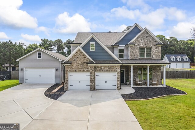830 Tom Miller Rd, Bethlehem, GA 30620 - craftsman-style home featuring driveway, covered porch, a garage, and brick siding