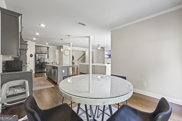 830 Tom Miller Rd, Bethlehem, GA 30620 - dining space featuring crown molding, baseboards, dark wood-style flooring, recessed lighting, and ceiling fan