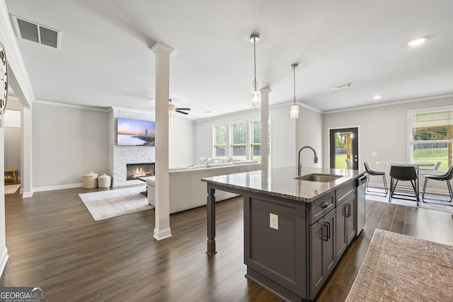 830 Tom Miller Rd, Bethlehem, GA 30620 - kitchen featuring a sink, crown molding, stainless steel dishwasher, open floor plan, and light stone countertops