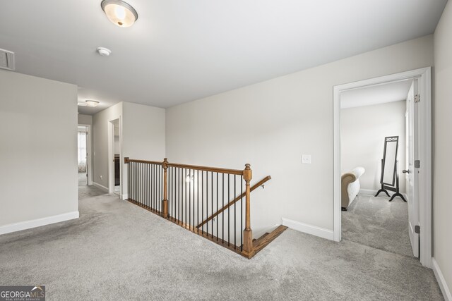 830 Tom Miller Rd, Bethlehem, GA 30620 - corridor with an upstairs landing, carpet floors, and baseboards