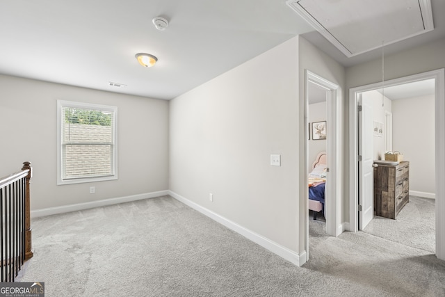 830 Tom Miller Rd, Bethlehem, GA 30620 - carpeted empty room with attic access, a smoke detector, and baseboards