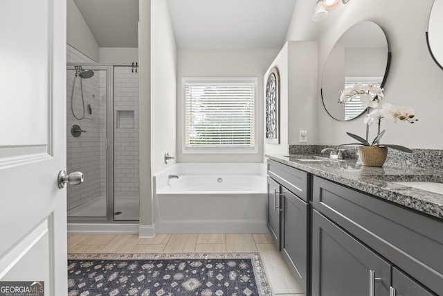 830 Tom Miller Rd, Bethlehem, GA 30620 - full bathroom featuring a bath, double vanity, and a shower stall