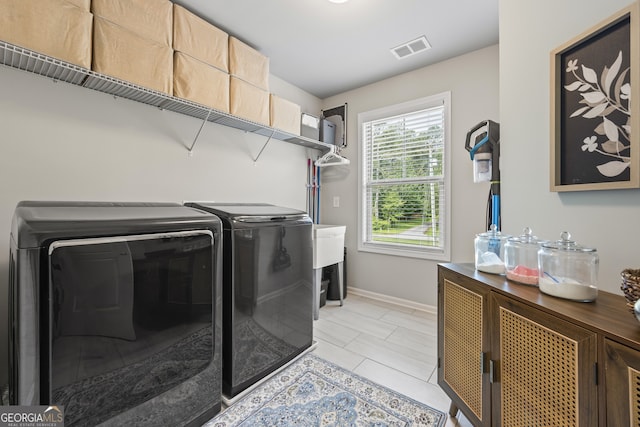 830 Tom Miller Rd, Bethlehem, GA 30620 - washroom with separate washer and dryer, baseboards, and light tile patterned floors