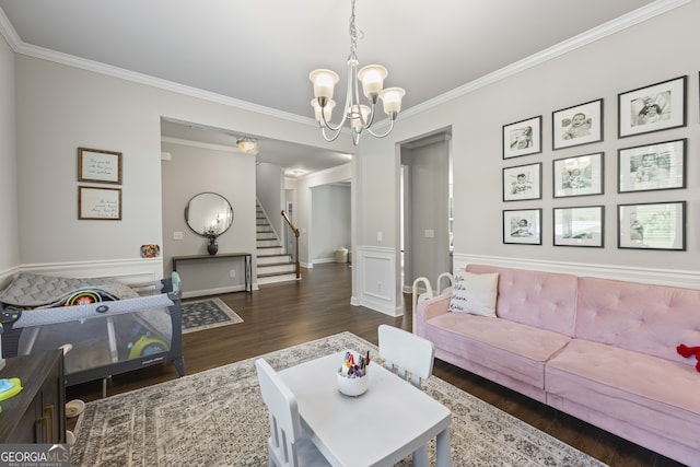 830 Tom Miller Rd, Bethlehem, GA 30620 - living area with a chandelier, wood finished floors, ornamental molding, stairway, and baseboards