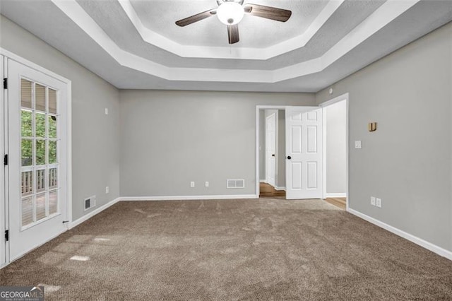 3927 Airline, Mcdonough, GA 30252 - carpeted spare room with a raised ceiling and ceiling fan