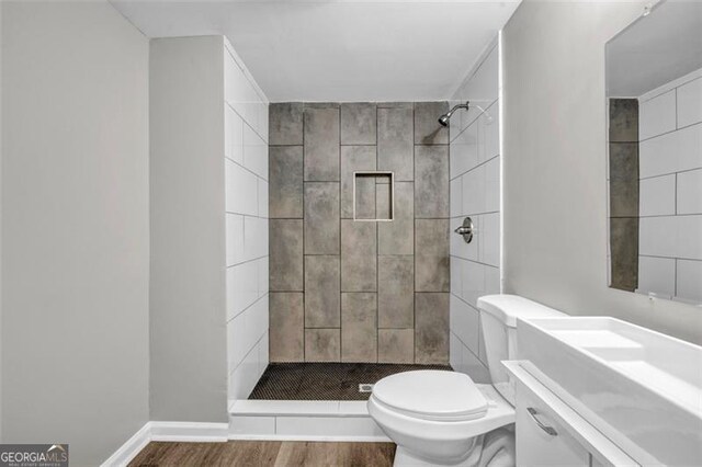 3927 Airline, Mcdonough, GA 30252 - full bathroom featuring wood finished floors, a shower stall, and vanity