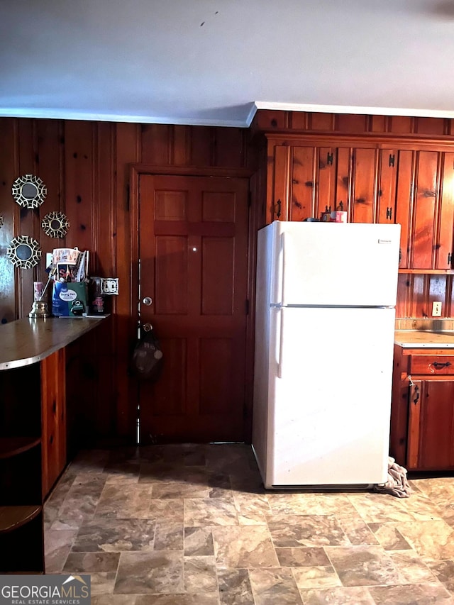 2526 Kensington Rd, Macon, GA 31211 - kitchen with freestanding refrigerator, stone finish floors, and open shelves