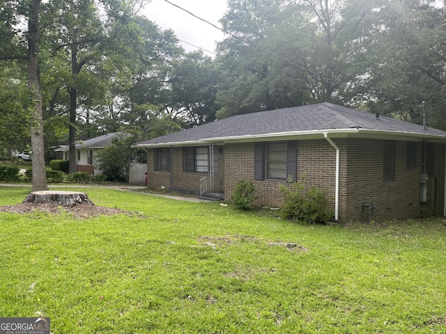 2526 Kensington Rd, Macon, GA 31211 - view of front of home with a front lawn, brick siding, and a shingled roof