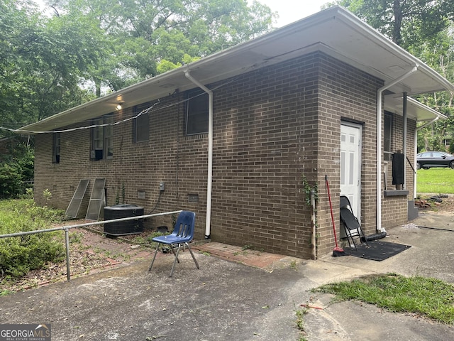 2526 Kensington Rd, Macon, GA 31211 - view of side of home with central air condition unit and brick siding
